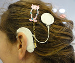Pince cheveux pour prothèses auditives et processeurs d'implant