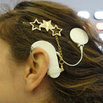 Barrette de maintien aide auditive ou processeur d’implant