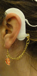 Boucle d’oreilles de maintien pour aide auditive ou processeur d’implant