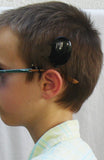 Attache lunettes pour prothèses auditives et processeurs d'implant